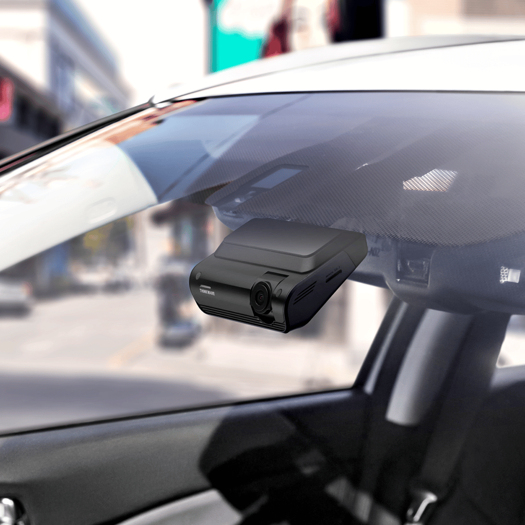 Thinkware Dash Cam Q1000 installed in the windscreen of a car